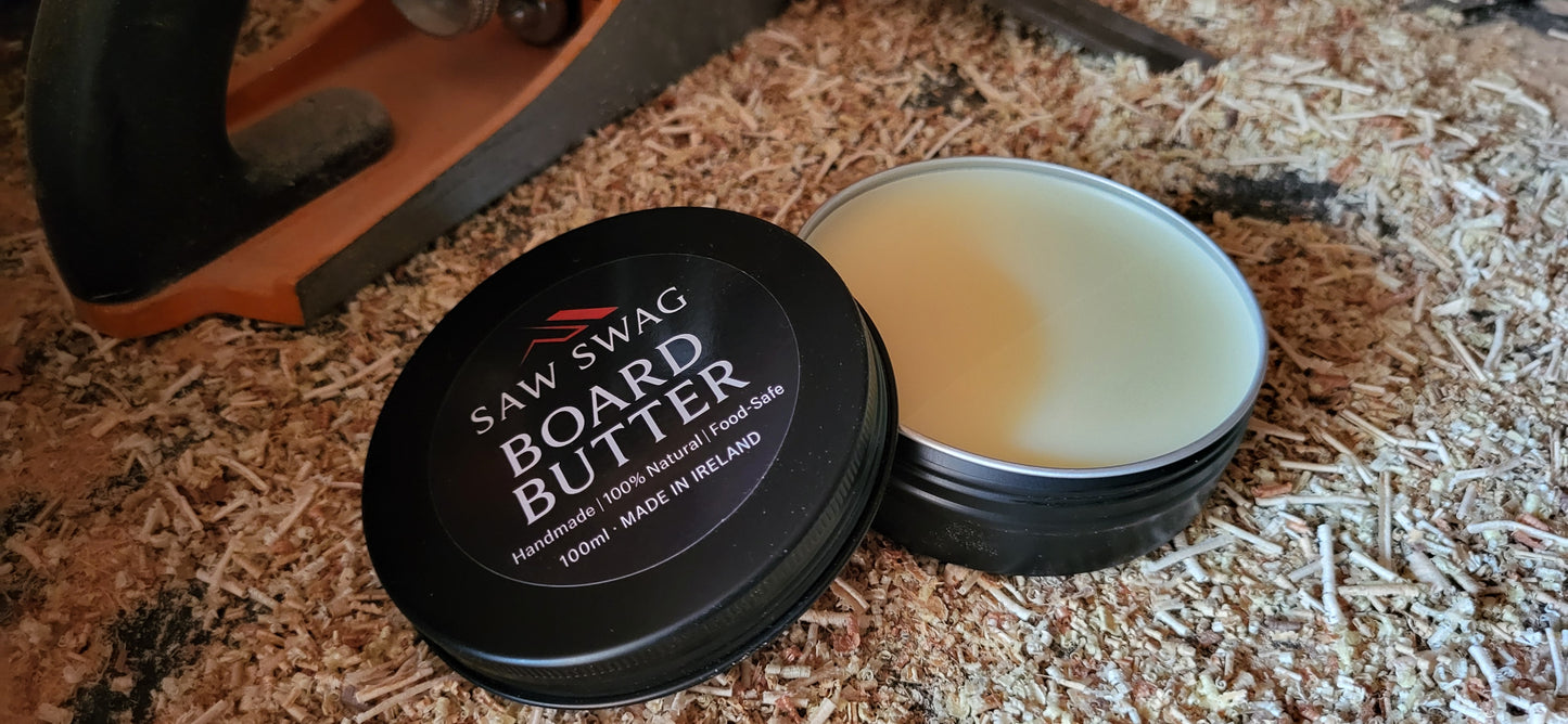 Board butter container with 'Saw Swag' branding on a wooden surface.