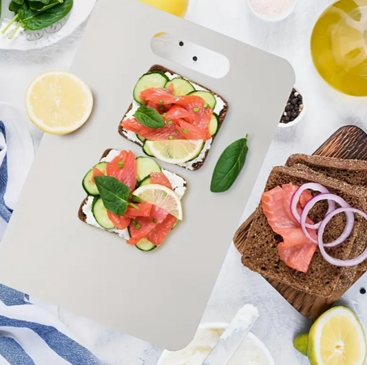Silver stainless steel prep board next to fresh ingredients