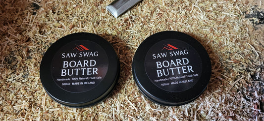 Handmade board butter tin on rustic sawdust