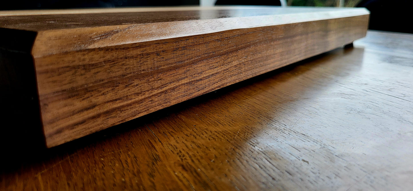 Side profile of butcher block showing board thickness with Saw Swag Board Butter on an oak farmhouse table
