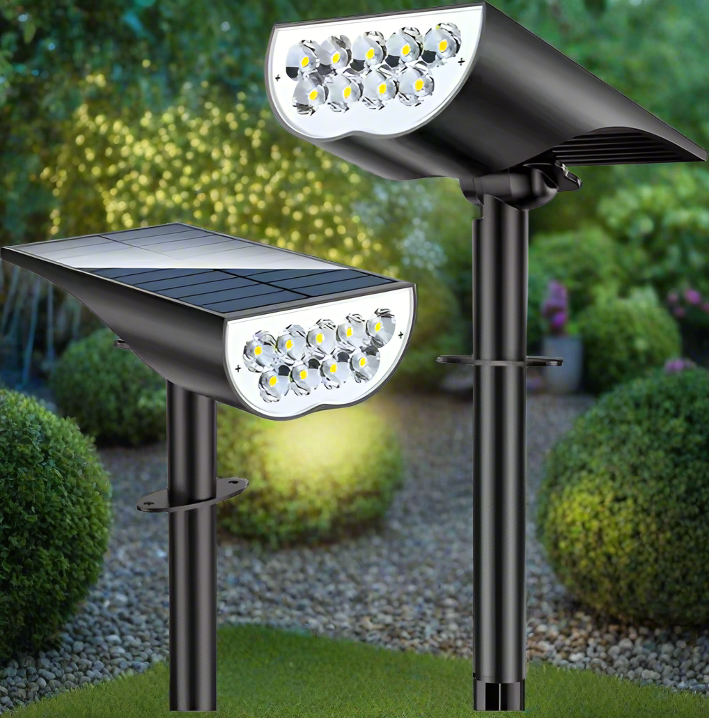 Two solar garden spotlights installed in soil
