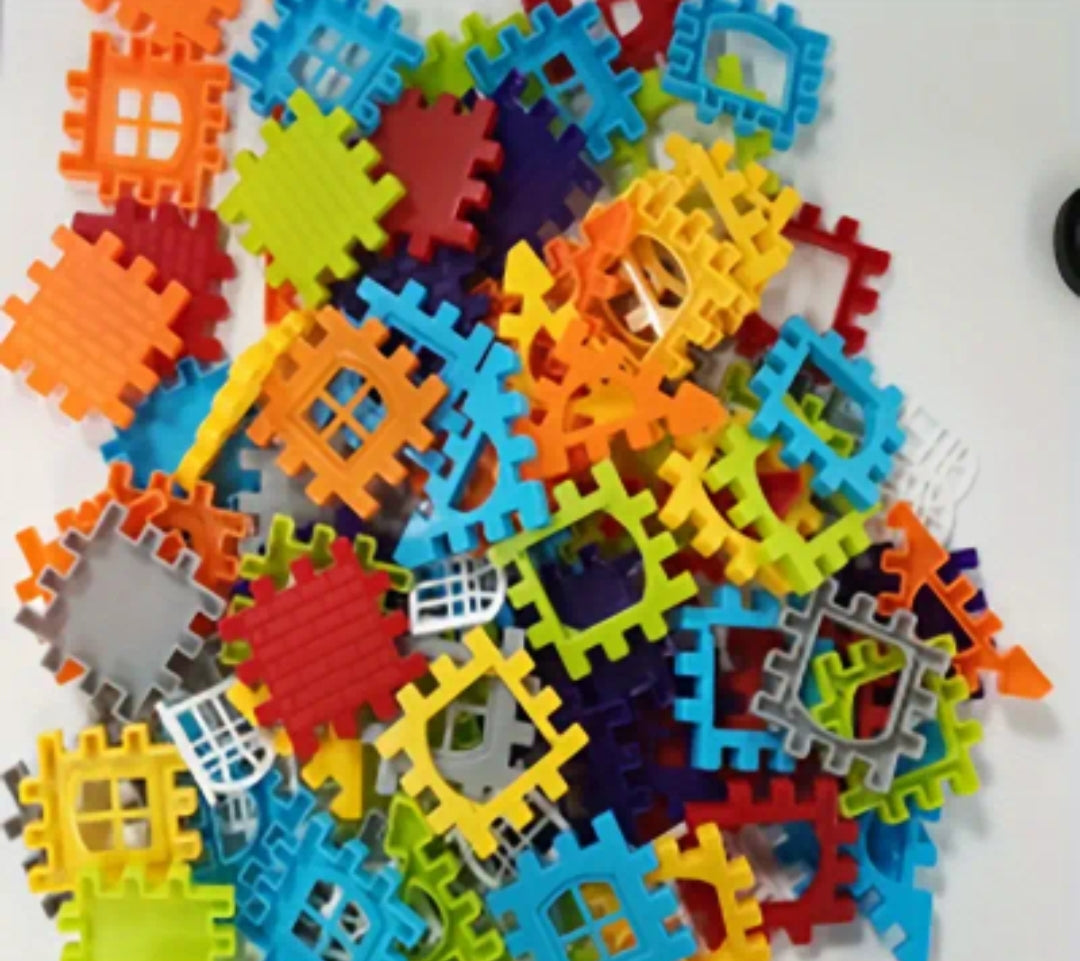 Kids building shapes with plastic interconnecting blocks