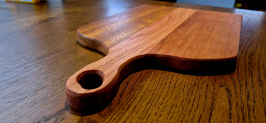 Close-up of the beautiful wood grain contrast between reddish Cherry, light Oak, and striped Southern Yellow Pine.
