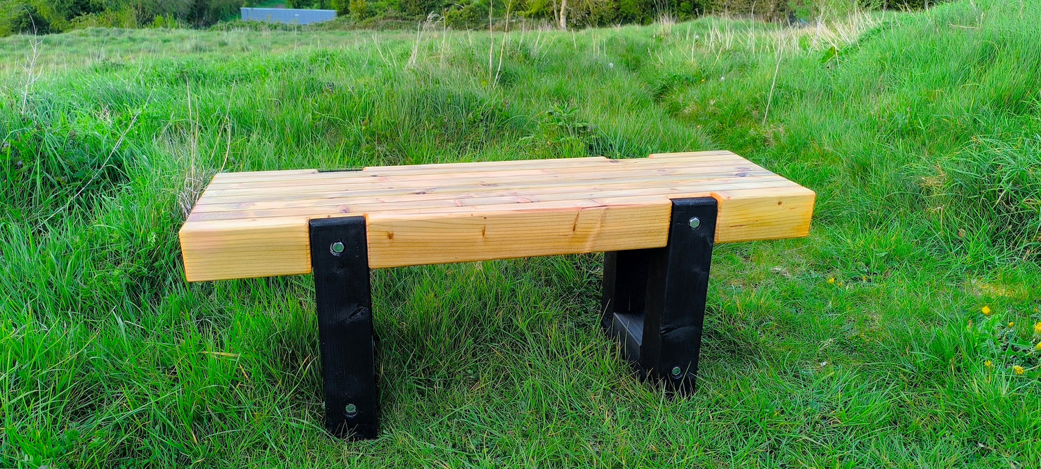 Handmade heavy-duty wooden garden furniture featuring chunky stabilized timber and industrial M12 bolts, built in Kildare for maximum longevity.