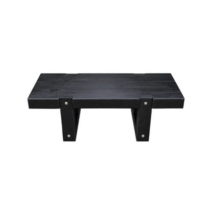 A black wooden coffee table with a thick rectangular top and two angled support legs, shown on a plain white background.