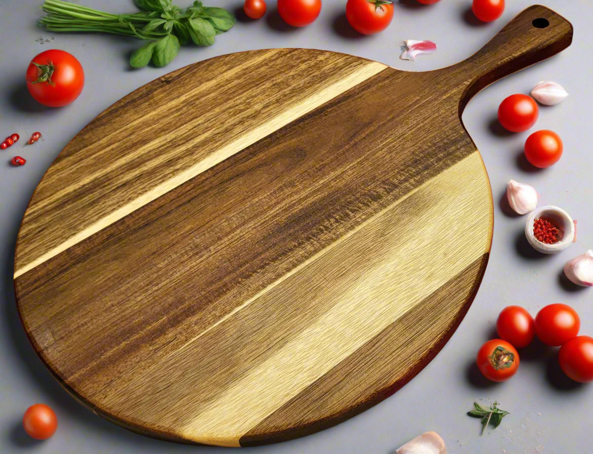 Round wooden pizza board on kitchen counter
