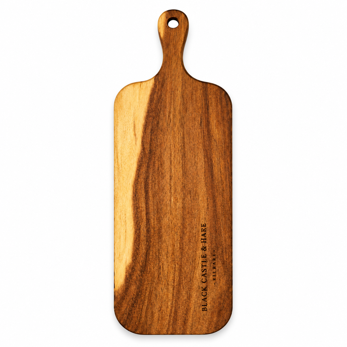 A wooden serving board with a rounded rectangular shape and a hanging hole at the top, featuring a prominent natural wood grain pattern with a darker brown center and lighter tan edges. The brand name 'BLACK CASTLE & HARE' is printed vertically on the lower right side.