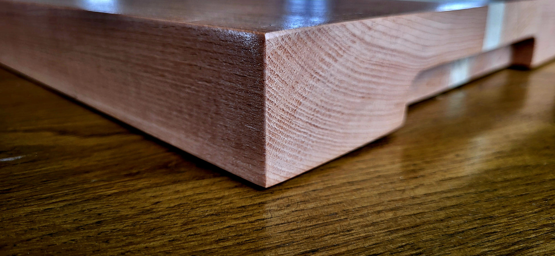Light-toned timber board styled with fresh herbs