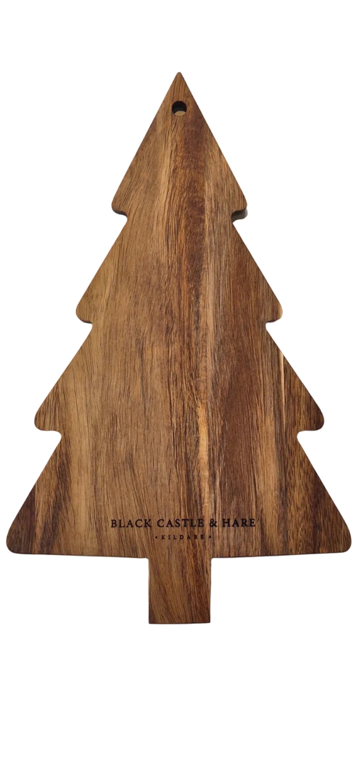 A Christmas tree-shaped wooden cutting board with a natural wood grain finish, featuring the engraved text 'BLACK CASTLE & SHARE' on a white surface.