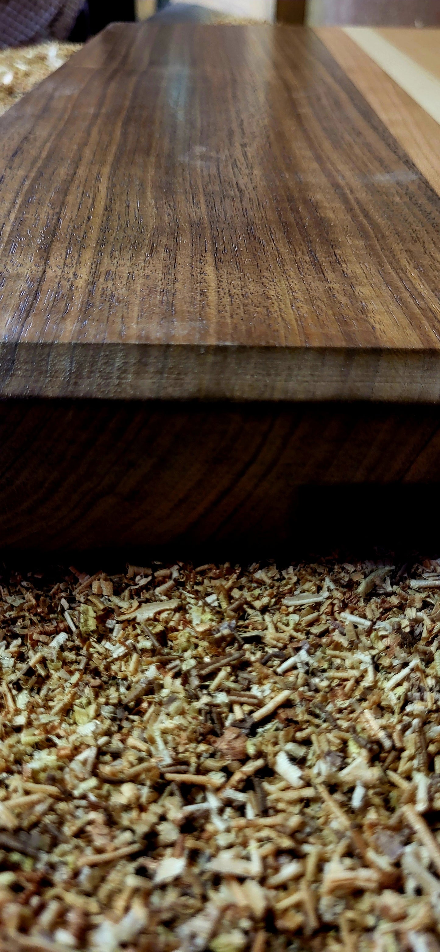 Close-up of a wooden surface with a textured base
