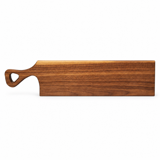 A rectangular wooden serving board with a rounded handle featuring a heart-shaped cutout, shown on a plain white background.