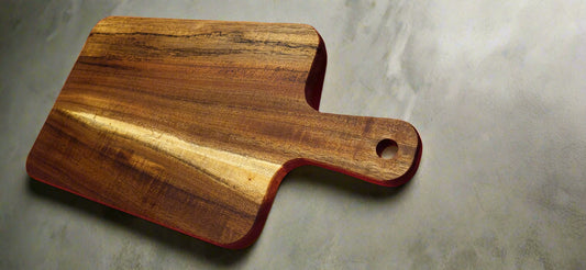 Modern wood serving board with crackers and dips