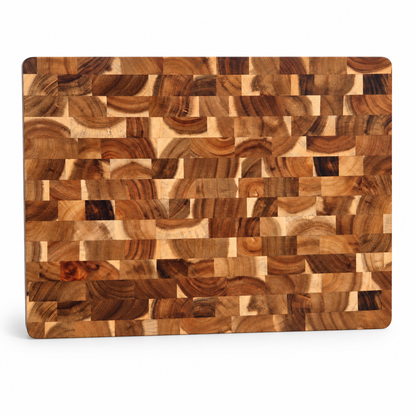 A rectangular wooden cutting board with rounded corners, featuring a detailed mosaic pattern of various wood grain blocks in warm brown and beige tones, shown on a clean white background.