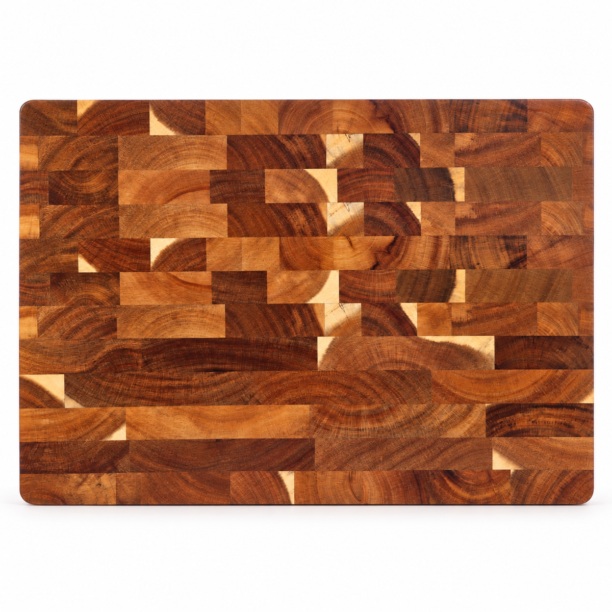 A rectangular wooden cutting board with a geometric block pattern made of multiple wood tones, shown from a top-down view on a white background.