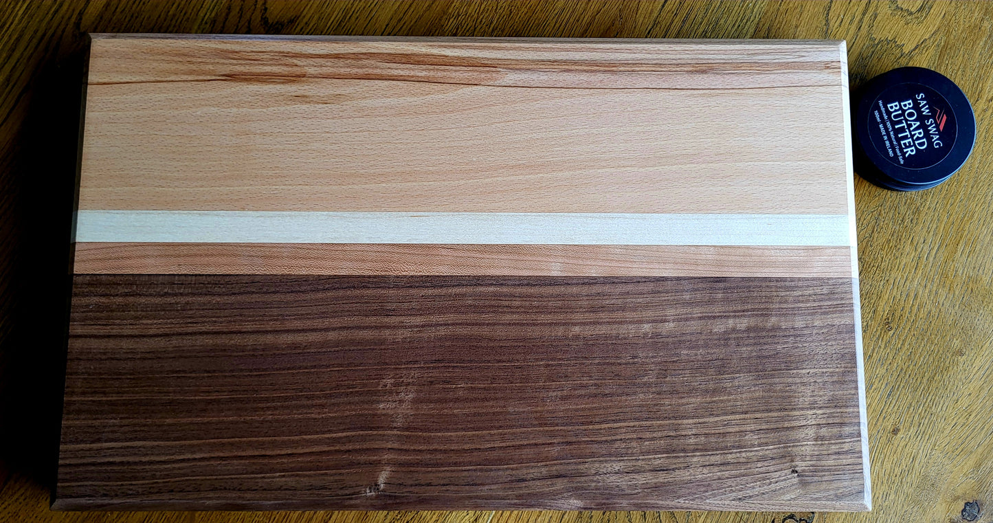 Wooden cutting board with a visible brand logo on a wooden surface