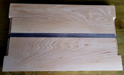 Reversible wood cutting board on countertop