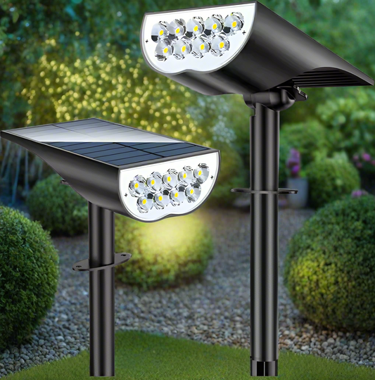 Two solar garden spotlights installed in soil