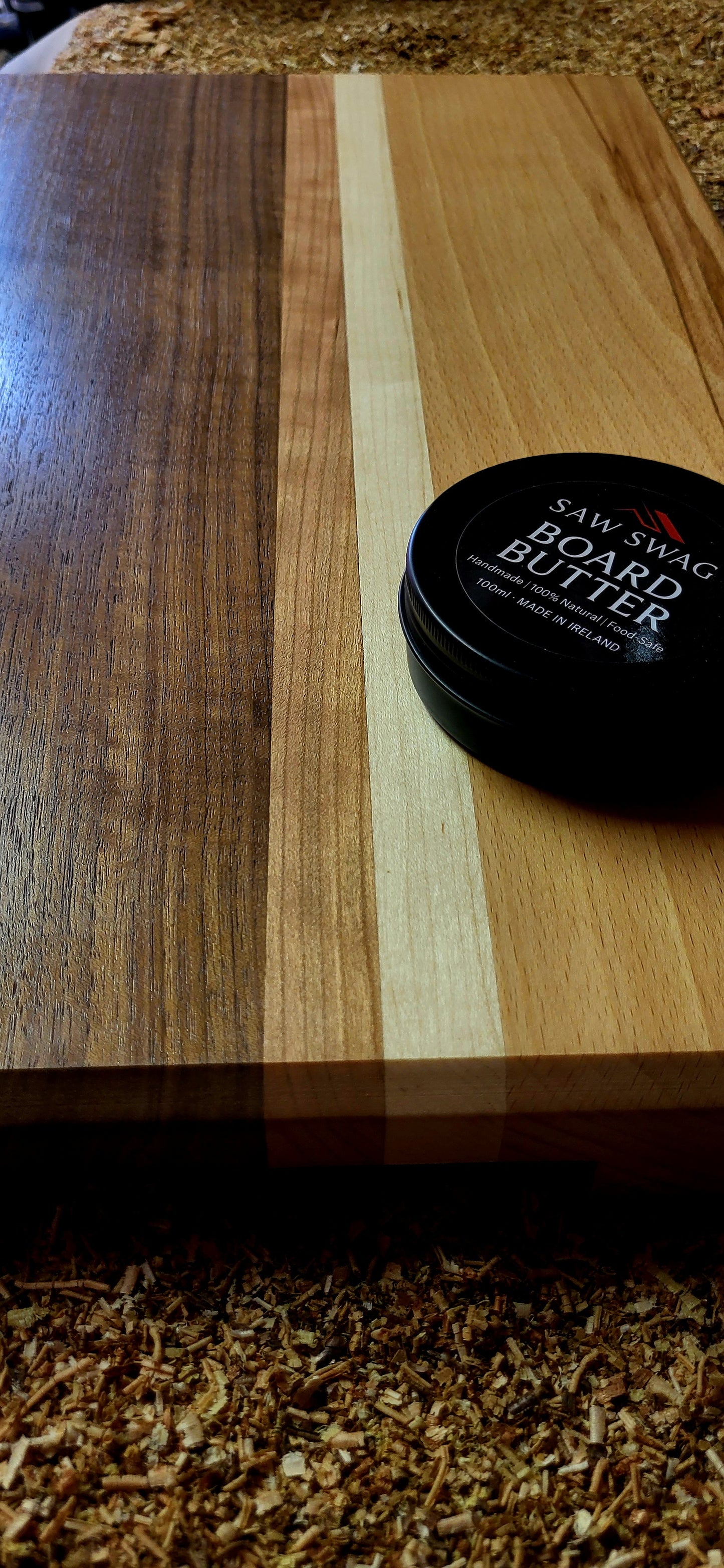 Detail of maple and cherry grain blend in chopping board and saw swag board butter
