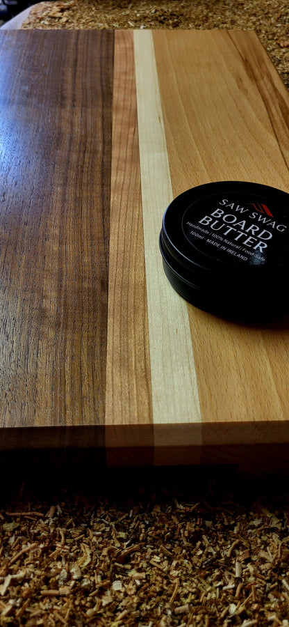 Detail of maple and cherry grain blend in chopping board and saw swag board butter