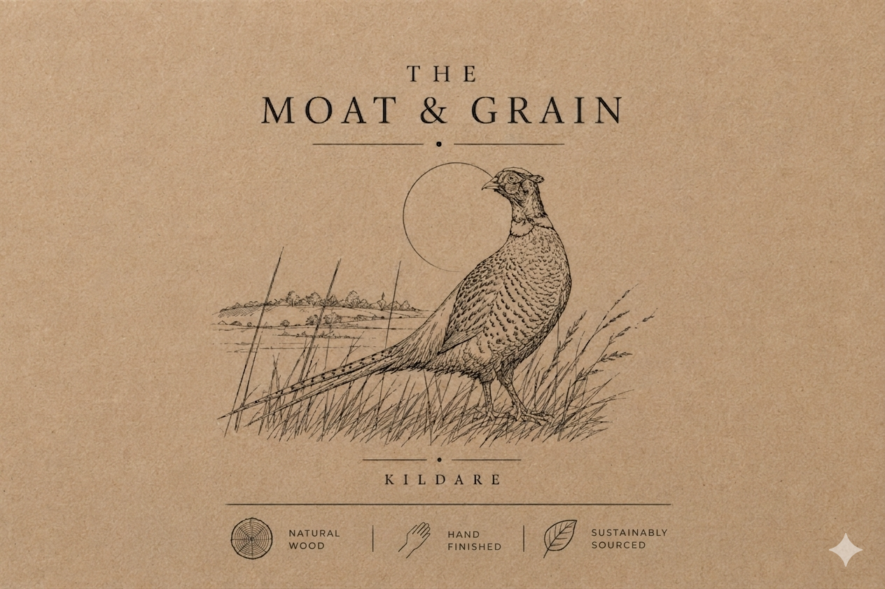 Logo of 'The Moat & Grain' with a bird illustration on a brown background