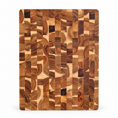 A rectangular wooden cutting board with rounded corners, featuring a mosaic pattern of varied wood grain blocks in warm brown and beige tones, shown against a plain white background.