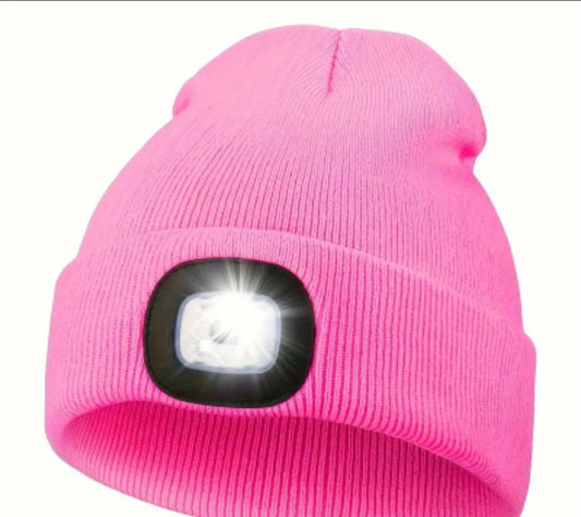 Warm knitted hat with LED light switched on