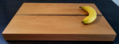 Natural finish wooden board with food prep display