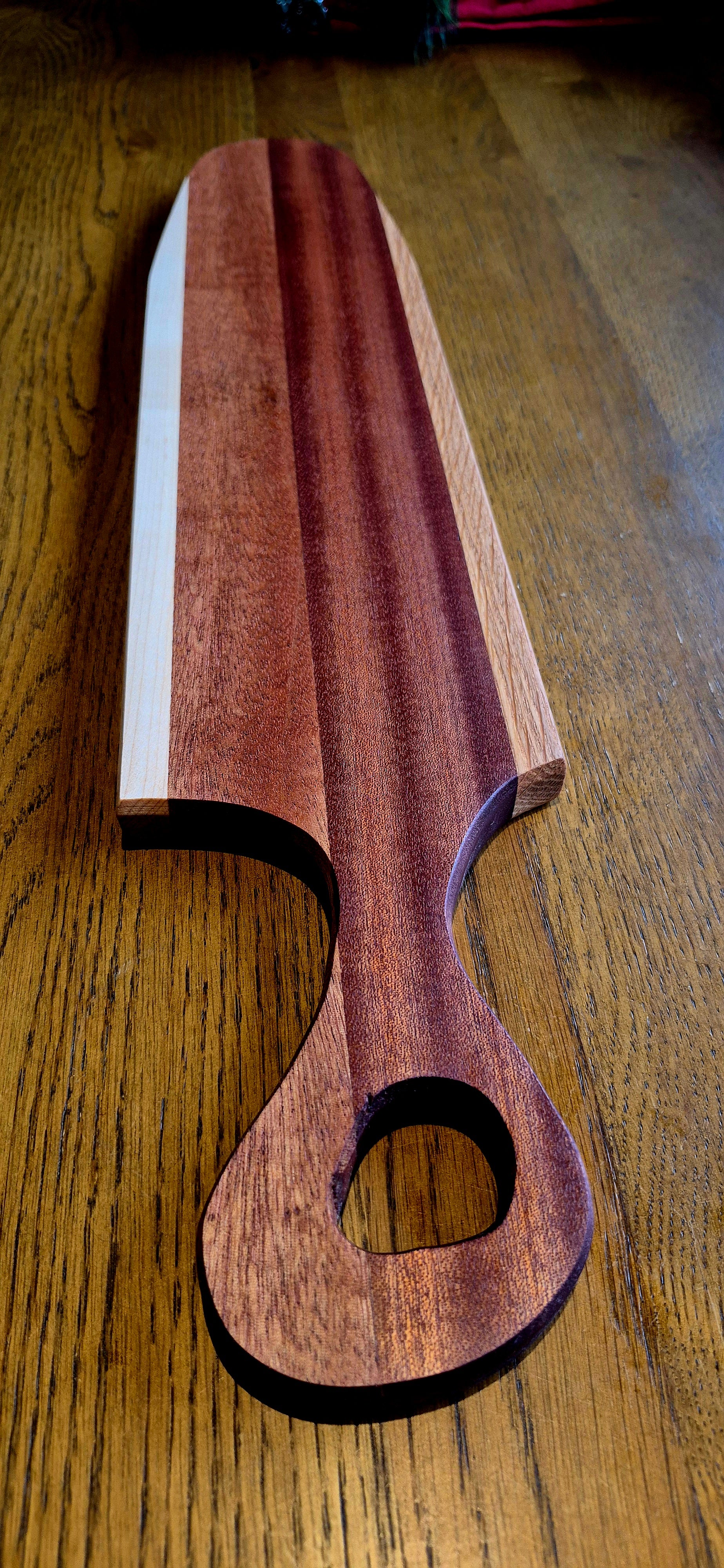 Large artisan charcuterie board featuring stripes of Oak and Sapele Mahogany