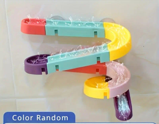 Colorful modular bath toy water track set attached to white bathroom tiles.