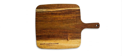 Large 350mm x 250mm acacia charcuterie board double oiled with food-safe mineral oil by Black Castle & Hare Kildare on white background.