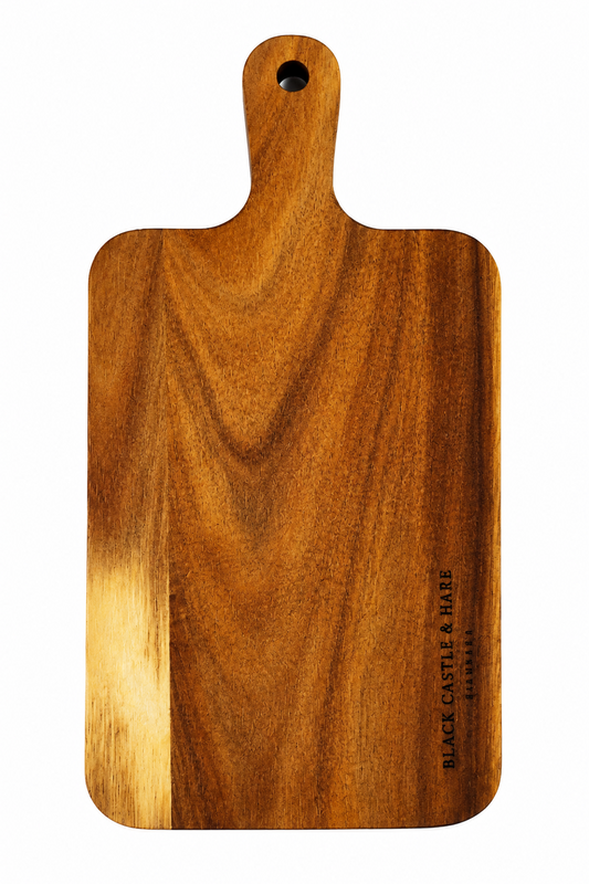 Personal 395mm x 195mm x 15mm acacia charcuterie board with rounded handle and convenience hole by Black Castle & Hare Kildare on white background