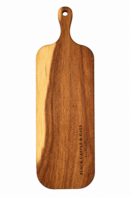 Personal-sized acacia wooden charcuterie board double oiled with food-safe mineral oil by Black Castle & Hare Kildare isolated on white background.