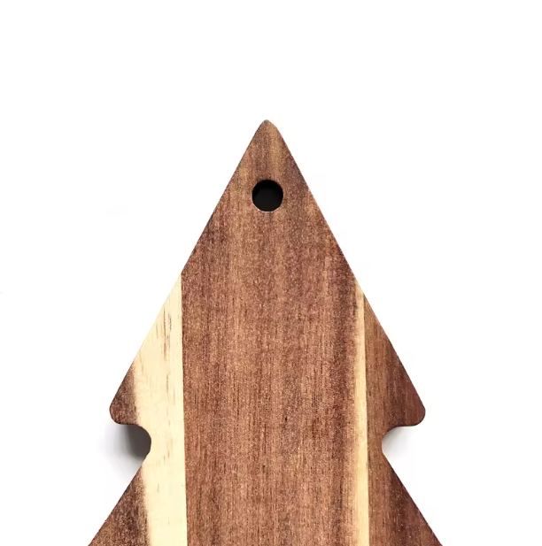 Wooden arrowhead-shaped cutting board on a white background