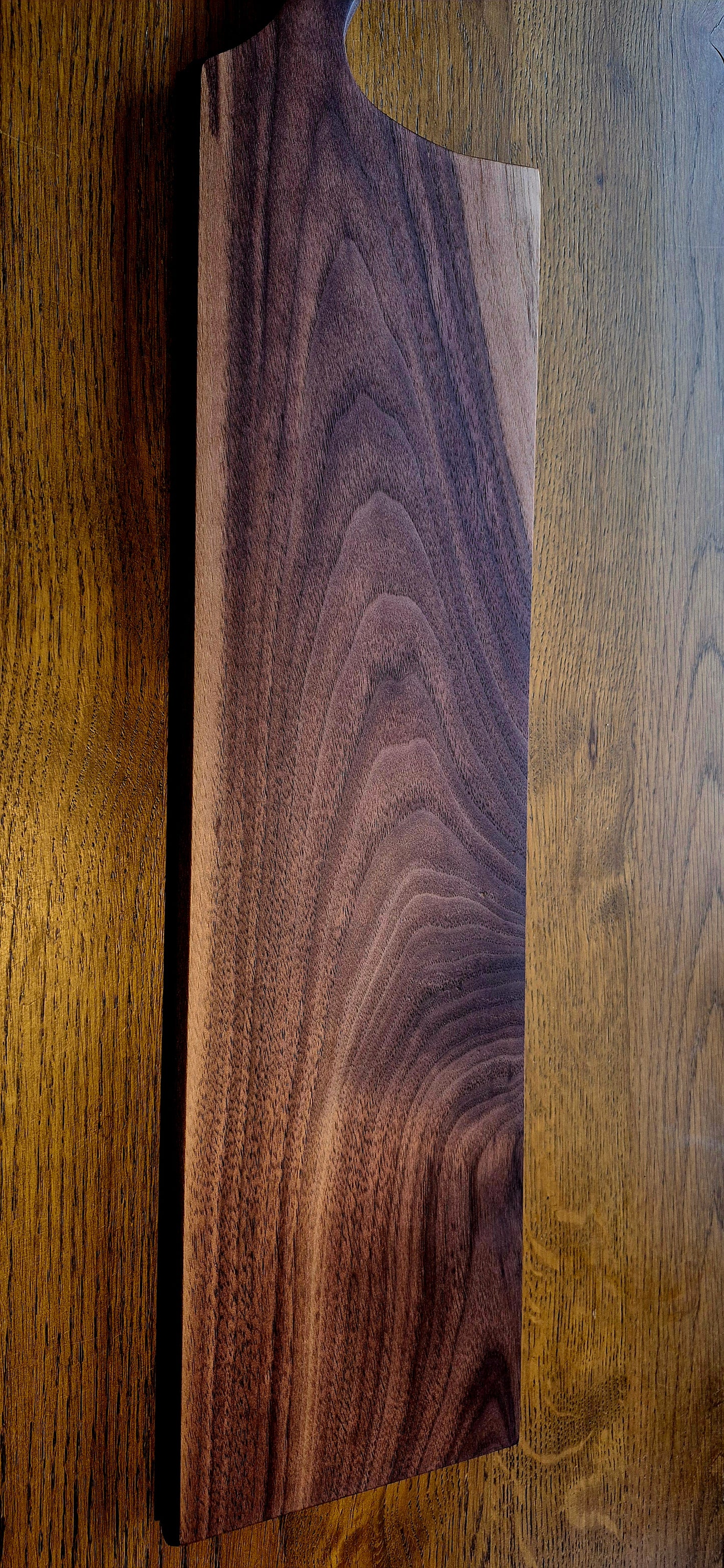 A 635mm extra-long solid Walnut grazing board with a rich dark finish and natural wood grain
