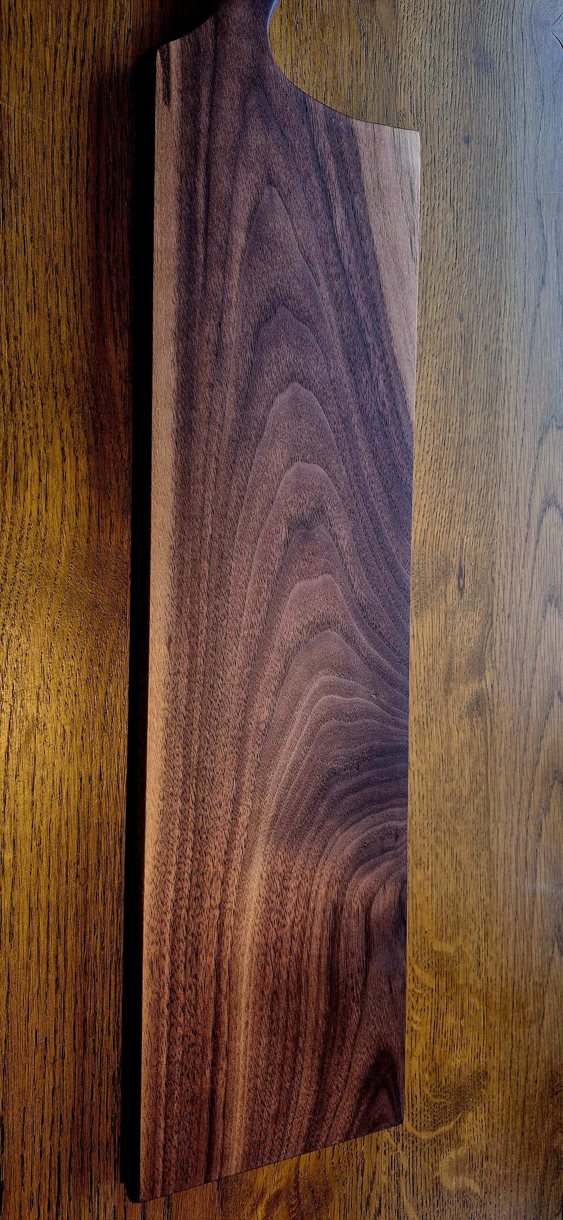 A 635mm extra-long solid Walnut grazing board with a rich dark finish and natural wood grain