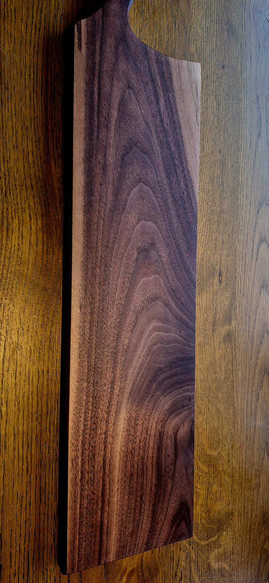 A 635mm extra-long solid Walnut grazing board with a rich dark finish and natural wood grain