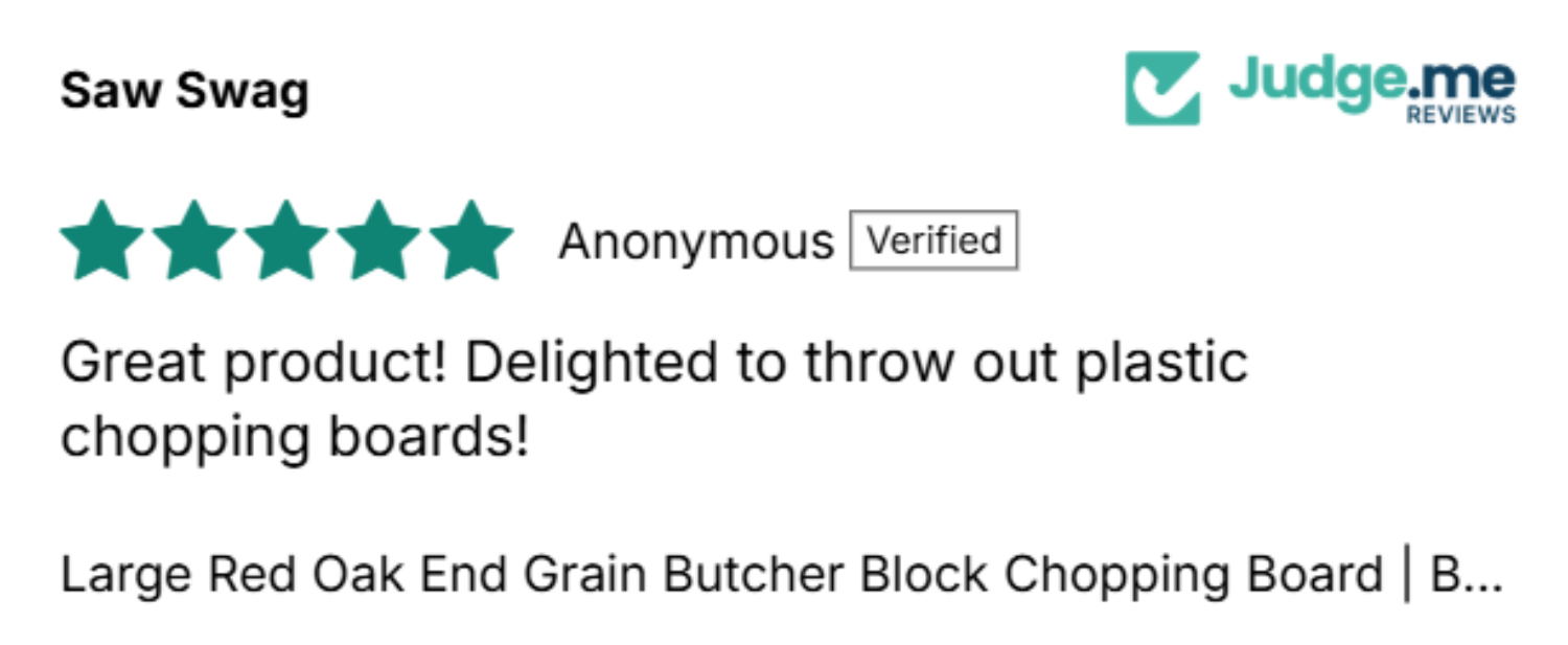 A product review card from Judge.me Reviews showing a 5-star anonymous review for a large red oak end grain butchering chopping board.