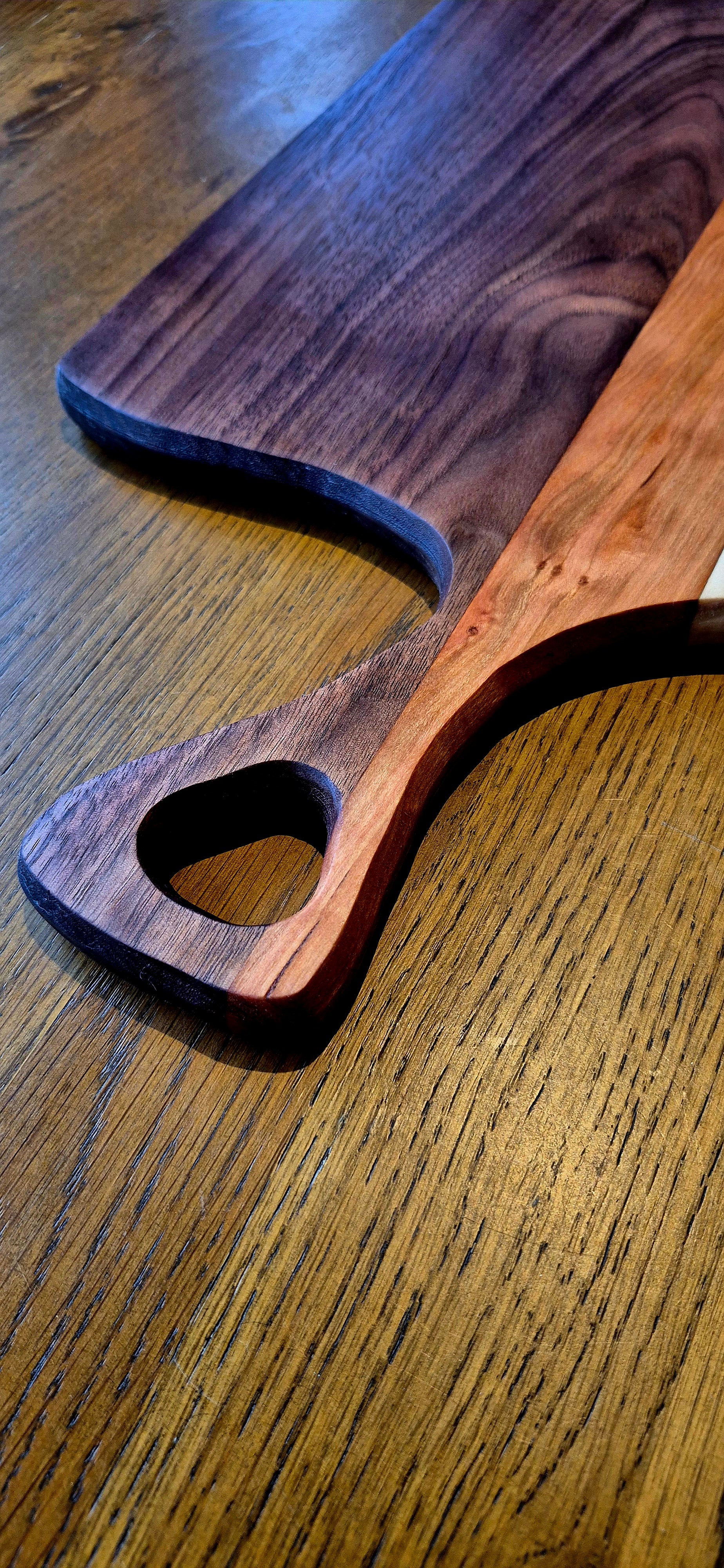 A 585mm long wooden charcuterie board styled with artisan bread and cheese, perfect for entertaining