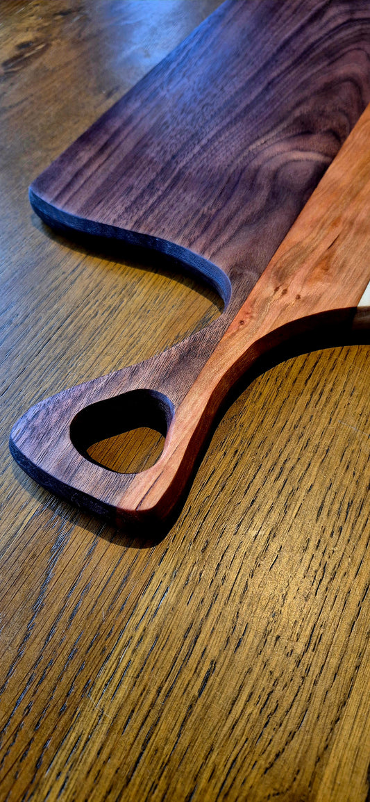 A 585mm long wooden charcuterie board styled with artisan bread and cheese, perfect for entertaining