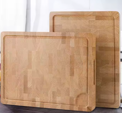Two Views of Black Castle and Hare Red Oak end grain cutting board leaning against a modern kitchen backsplash