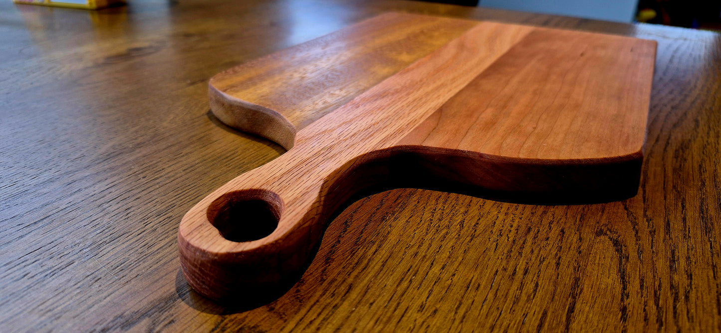 Close-up of the beautiful wood grain contrast between reddish Cherry, light Oak, and striped Southern Yellow Pine.