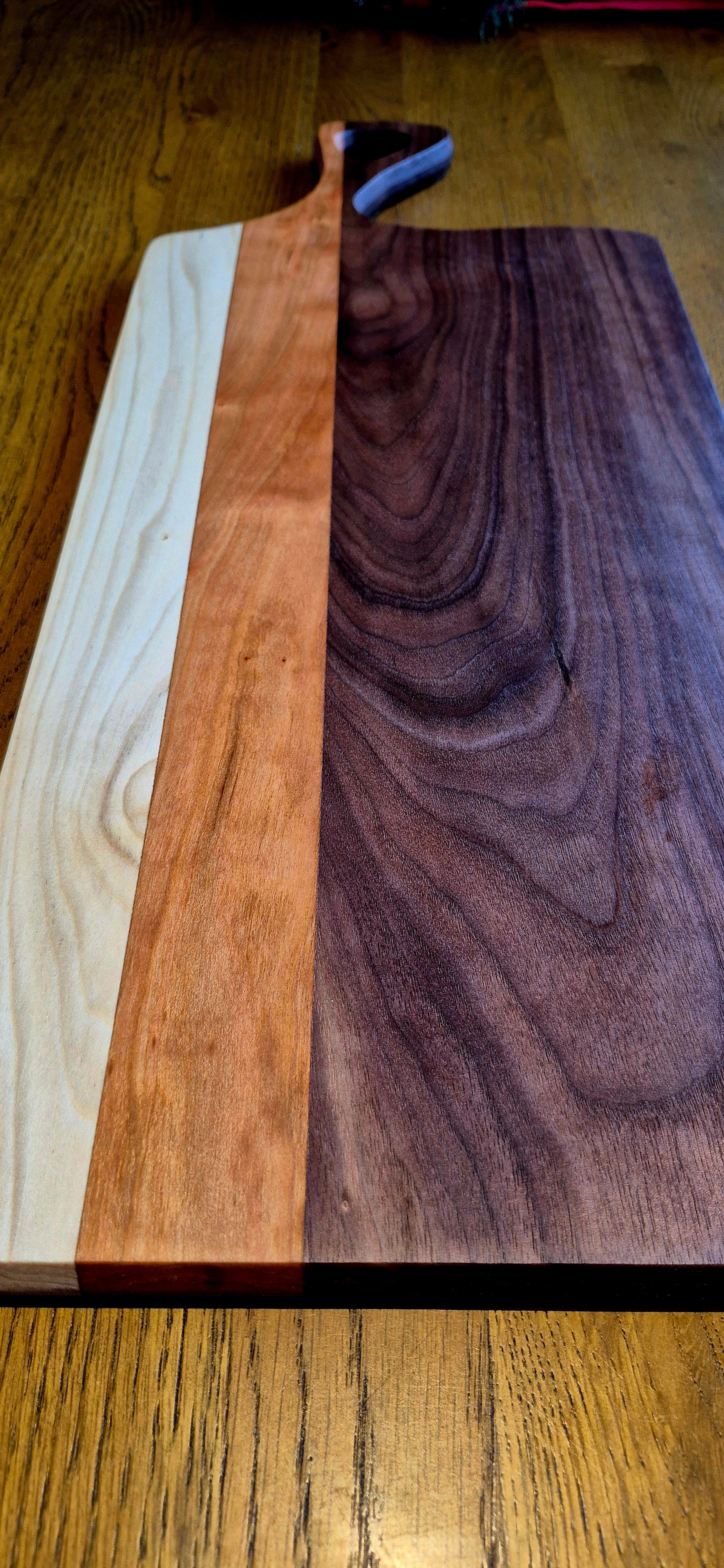 top view of a 585 x 230 x 20mm striped hardwood board showing the slim, modern profile and smooth edges