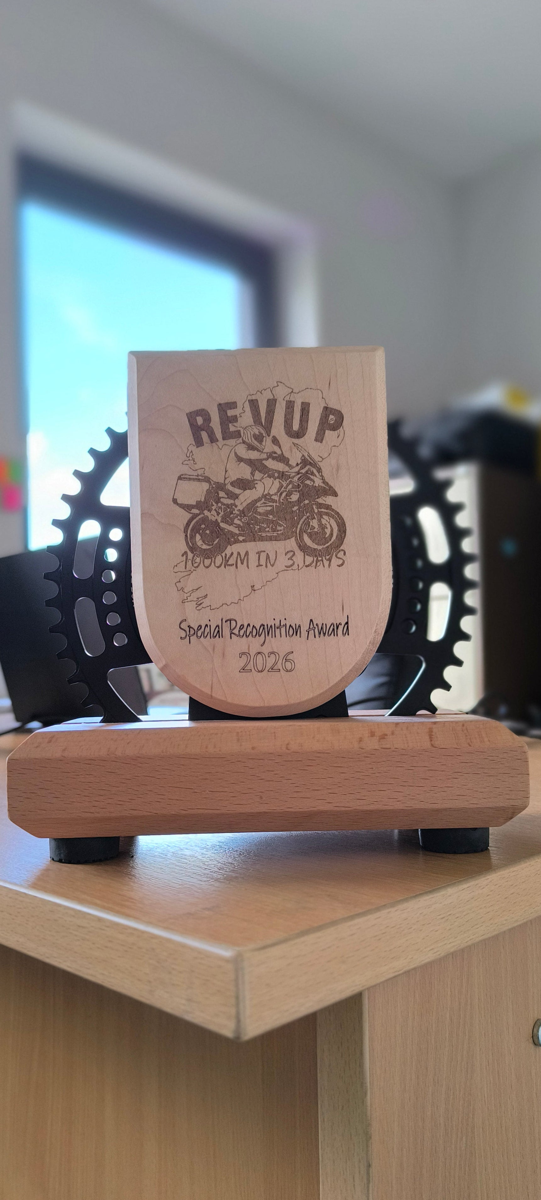 Premium corporate recognition trophy blending industrial steel and organic wood for a striking, modern boardroom aesthetic