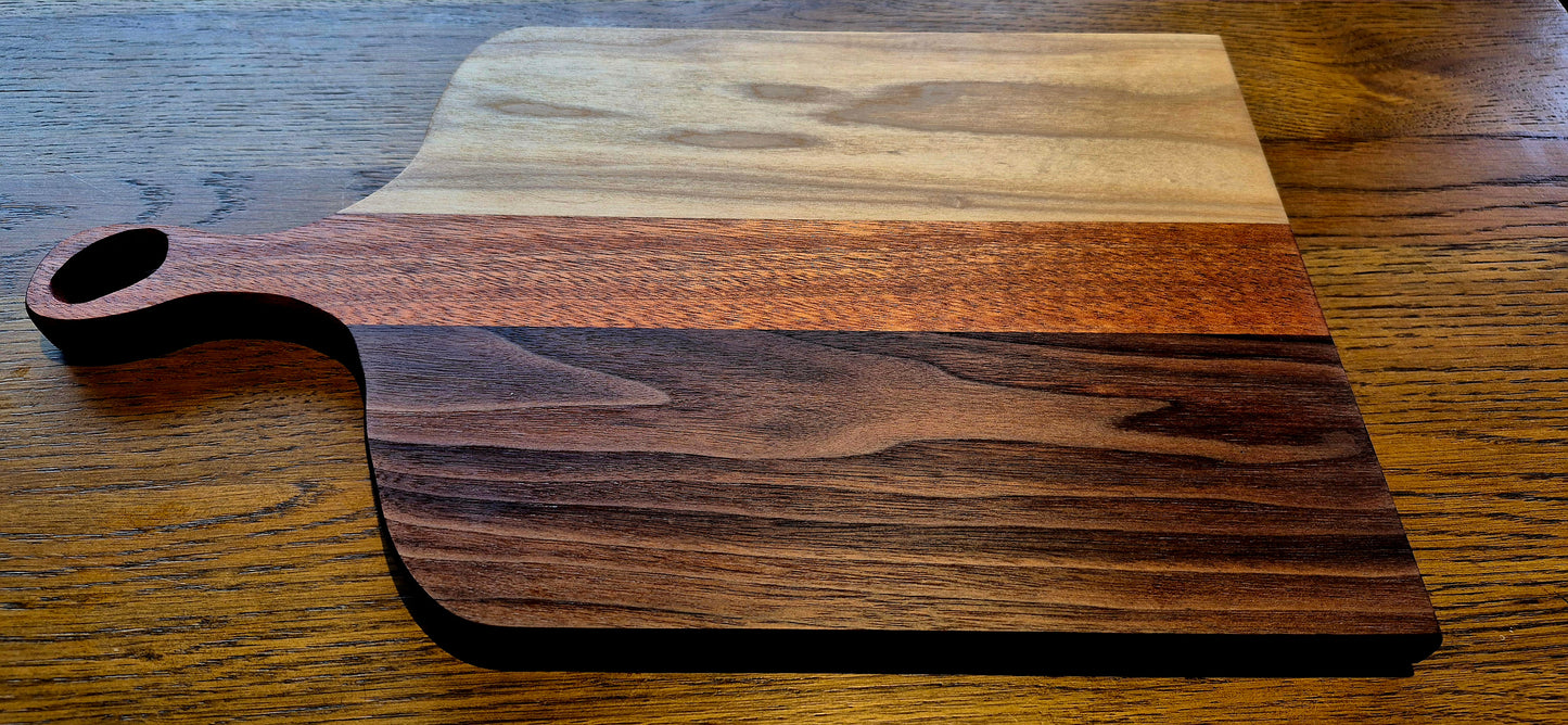 Dark walnut tones contrasted with pale poplar in handcrafted board