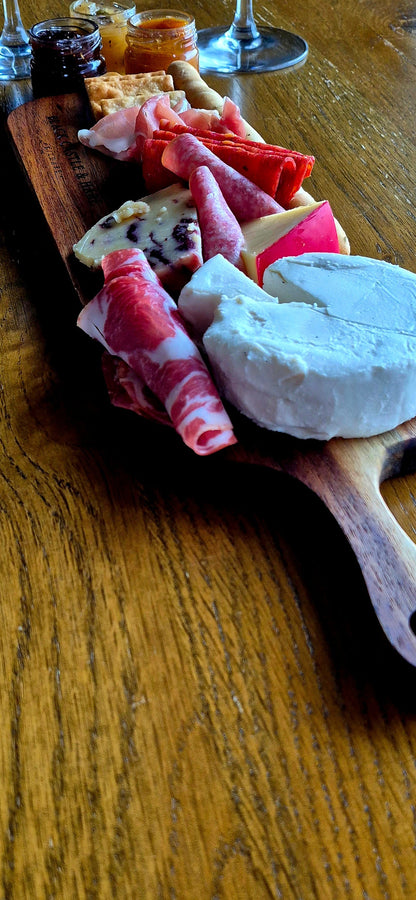 Gourmet meat and cheese selection served on a personal mineral-oiled acacia wooden board by Black Castle & Hare Kildare.